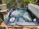 Close up of a hot tub featuring jets, controls and a waterfall feature at 10532 Cory Lake Dr, Tampa, FL 33647