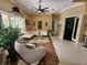 Spacious living area with stylish furniture, a massage chair, and elegant decor at 10532 Cory Lake Dr, Tampa, FL 33647