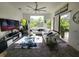 Bright living room with a large window, comfortable white sofa, and stylish decor at 10532 Cory Lake Dr, Tampa, FL 33647
