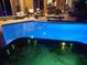 Exterior view of pool and hot tub with night accent lighting. Lounge furniture visible at 10532 Cory Lake Dr, Tampa, FL 33647