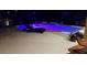Exterior view of the pool and lounge area at night with accent lighting at 10532 Cory Lake Dr, Tampa, FL 33647