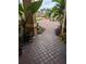 Paver walkway and driveway enhanced with landscaping leading to the home at 10532 Cory Lake Dr, Tampa, FL 33647
