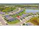 Expansive aerial view showcasing a vibrant neighborhood with lush greenery, ponds, and well-maintained landscaping at 10945 High Noon Trl, Parrish, FL 34219