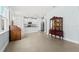 Bright and open living space with tile floors connecting the living room and kitchen, great for entertaining at 10945 High Noon Trl, Parrish, FL 34219