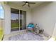 Charming patio with comfortable seating, stylish rug, and tranquil outdoor view at 10945 High Noon Trl, Parrish, FL 34219