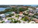 Stunning aerial view of a waterfront home with lush landscaping and scenic neighborhood views at 1156 2Nd S Ave, Tierra Verde, FL 33715