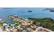 Scenic aerial view of a waterfront neighborhood with beautiful homes, canals, and stunning ocean views at 1156 2Nd S Ave, Tierra Verde, FL 33715