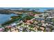 Expansive aerial view of a resort neighborhood featuring waterways, lush landscaping, and luxurious homes at 1156 2Nd S Ave, Tierra Verde, FL 33715