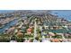 Stunning aerial view of a waterfront neighborhood with canal access and well-maintained homes at 1156 2Nd S Ave, Tierra Verde, FL 33715