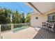Deck overlooking the pool area, complemented by outdoor seating, lush vegetation, and a tranquil ambiance at 1156 2Nd S Ave, Tierra Verde, FL 33715