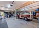 Spacious garage with ample storage space and vintage woody wagon, a car enthusiast's dream at 1156 2Nd S Ave, Tierra Verde, FL 33715