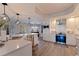 Spacious kitchen featuring a central island, stainless steel appliances, and contemporary pendant lighting at 1156 2Nd S Ave, Tierra Verde, FL 33715
