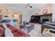 Bright and spacious living room with modern fireplace, stylish furniture, and an open floorplan to the kitchen at 1156 2Nd S Ave, Tierra Verde, FL 33715