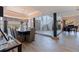 Open-concept design featuring a dining area and stylish staircase, seamlessly connected with modern finishes at 1156 2Nd S Ave, Tierra Verde, FL 33715