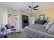 Main bedroom featuring balcony access, a comfortable chaise lounge, and stylish marble furniture at 1156 2Nd S Ave, Tierra Verde, FL 33715