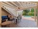Covered outdoor patio with furniture, ceiling fan, and views of the pool at 1156 2Nd S Ave, Tierra Verde, FL 33715