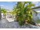 Landscaped backyard featuring a paved patio area, providing a private oasis for relaxation and outdoor activities at 11602 Sunburst Marble Rd, Riverview, FL 33579