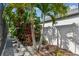 A well-manicured backyard featuring lush landscaping, offering a serene and private outdoor space at 11602 Sunburst Marble Rd, Riverview, FL 33579