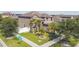 Charming two-story home with a manicured lawn, mature trees, and inviting curb appeal at 11602 Sunburst Marble Rd, Riverview, FL 33579