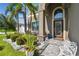 Inviting front entrance with a beautifully landscaped yard and covered entryway at 11602 Sunburst Marble Rd, Riverview, FL 33579