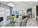 Open concept kitchen with stainless steel appliances and marble flooring, seamlessly connected to the dining and living areas at 11602 Sunburst Marble Rd, Riverview, FL 33579