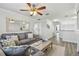 Cozy living room with a ceiling fan, neutral decor, and wood-look flooring for a modern feel at 11602 Sunburst Marble Rd, Riverview, FL 33579