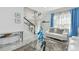 A bright and airy living room and dining area with contemporary décor at 11602 Sunburst Marble Rd, Riverview, FL 33579
