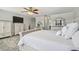 Spacious bedroom showcasing a decorative rug, white furniture set, and ample storage space at 11602 Sunburst Marble Rd, Riverview, FL 33579