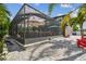 Extended outdoor patio featuring a screened enclosure, providing a comfortable space for outdoor entertaining at 11602 Sunburst Marble Rd, Riverview, FL 33579