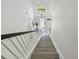 A bright foyer features a staircase, a front door with transom window and a chandelier at 11602 Sunburst Marble Rd, Riverview, FL 33579