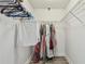 Organized walk-in closet with ample hanging space and wire shelving, perfect for storage at 11602 Sunburst Marble Rd, Riverview, FL 33579