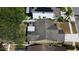 Aerial view of a single-Gathering home showcasing the roof, screened-in patio, and the surrounding neighborhood at 11641 Branch Mooring Dr, Tampa, FL 33635