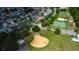 Aerial photograph displays a community recreation area featuring a baseball field and fenced basketball courts at 11641 Branch Mooring Dr, Tampa, FL 33635
