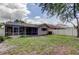 Expansive backyard featuring an enclosed patio area and privacy fencing at 11641 Branch Mooring Dr, Tampa, FL 33635