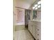 Updated bathroom featuring a shower-tub combo and a spacious vanity with ample storage at 11641 Branch Mooring Dr, Tampa, FL 33635