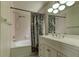 Well-lit bathroom features a shower-tub combo and a spacious vanity with ample storage at 11641 Branch Mooring Dr, Tampa, FL 33635