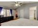 Comfortable bedroom with walkout access to lanai and an en suite bathroom at 11641 Branch Mooring Dr, Tampa, FL 33635