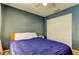 Bedroom featuring blue walls and a closet with sliding doors at 11641 Branch Mooring Dr, Tampa, FL 33635
