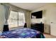 Bedroom features a large window providing natural light and a contemporary dark dresser at 11641 Branch Mooring Dr, Tampa, FL 33635
