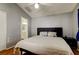 Bright bedroom with a ceiling fan and an en suite bathroom view is move-in ready at 11641 Branch Mooring Dr, Tampa, FL 33635