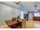 Cozy dining room with hardwood floors and a view into the living room at 11641 Branch Mooring Dr, Tampa, FL 33635