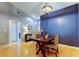 Stylish dining area with an elegant chandelier, hardwood floors, and a pop of color at 11641 Branch Mooring Dr, Tampa, FL 33635