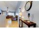 Spacious entryway with console table leading into a living room with hardwood floors at 11641 Branch Mooring Dr, Tampa, FL 33635