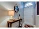 Bright entryway featuring console table, decorative mirror, and tiled floors at 11641 Branch Mooring Dr, Tampa, FL 33635