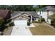 Beautiful aerial view of a single-Gathering home with manicured landscaping and a two-car garage at 11641 Branch Mooring Dr, Tampa, FL 33635