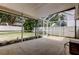 Covered and screened patio offering a relaxing outdoor living space with a view of the backyard at 11641 Branch Mooring Dr, Tampa, FL 33635
