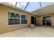 Spacious covered patio with access to the backyard and interior sliding door at 11641 Branch Mooring Dr, Tampa, FL 33635