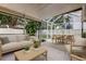 Inviting screened-in patio featuring comfortable seating and dining area, perfect for outdoor relaxation at 11641 Branch Mooring Dr, Tampa, FL 33635