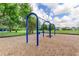 Community playground with swings and wood chip ground cover, set amongst lush green grass and mature shade trees at 11641 Branch Mooring Dr, Tampa, FL 33635