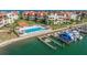 Waterfront condo community featuring a swimming pool, private boat docks and beautiful landscaping at 120 1St E St # 109, Tierra Verde, FL 33715